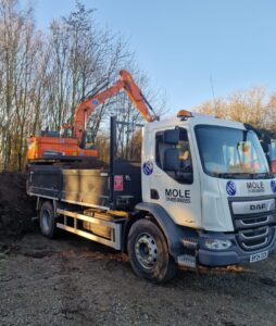Excavator 360 digger from our operated plant hire loading a 10 tonne tipper Leicester